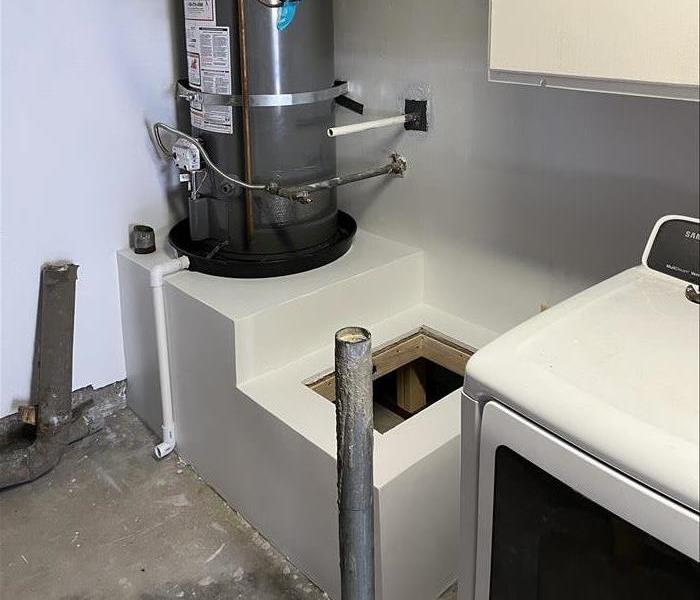 Mold remediation and rebuilt water heater stand