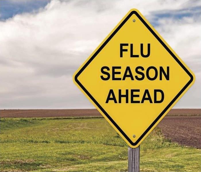 yellow caution sign "Flu season ahead" 