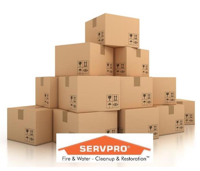 tan moving boxes, white background and SERVPRO logo