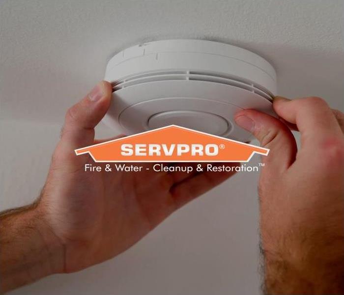 white smoke alarm, with SERVPRO logo 
