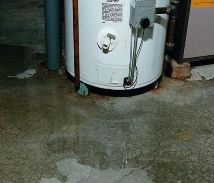 gray floor, white water heater in basement 